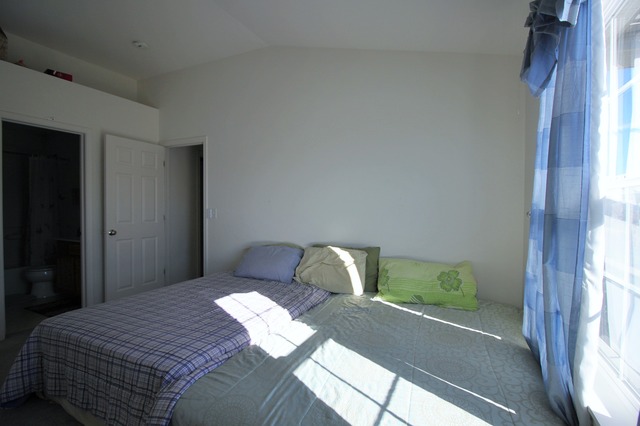 3082 Patterson Road Montgomery, IL 60538 - Photo 22 of 25 a bedroom with a bed and a window