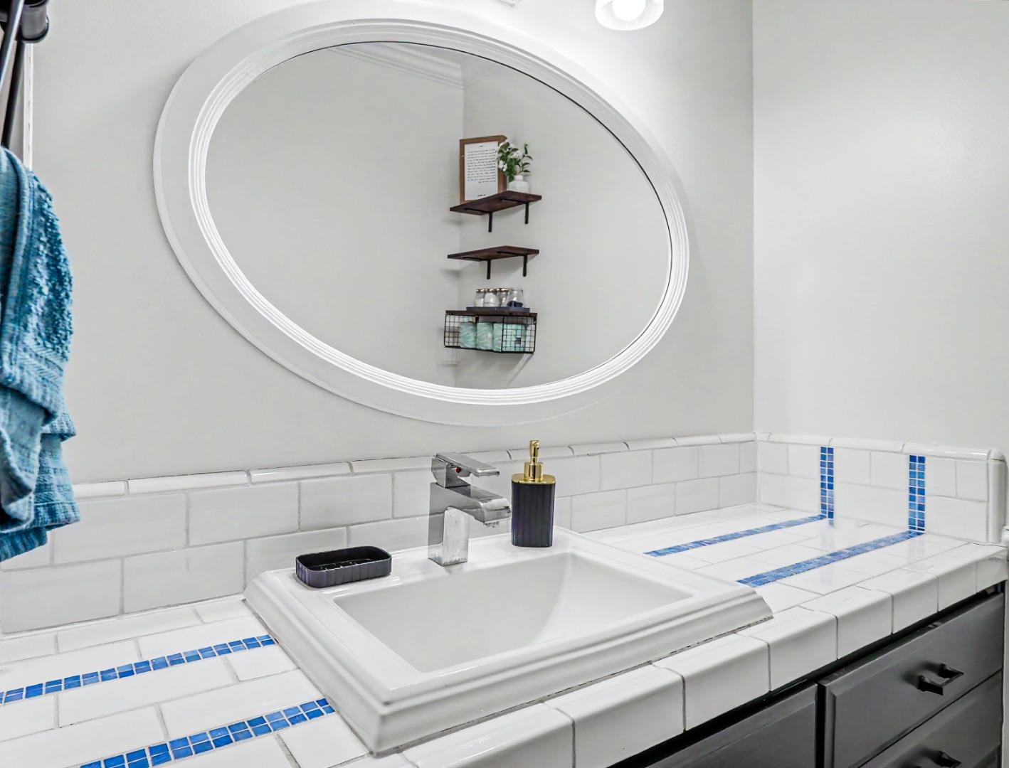 1310 Primavera Street, Unit 109 Salinas, CA 93901 - Photo 14 of 37 a close view of sink and tap with bathtub