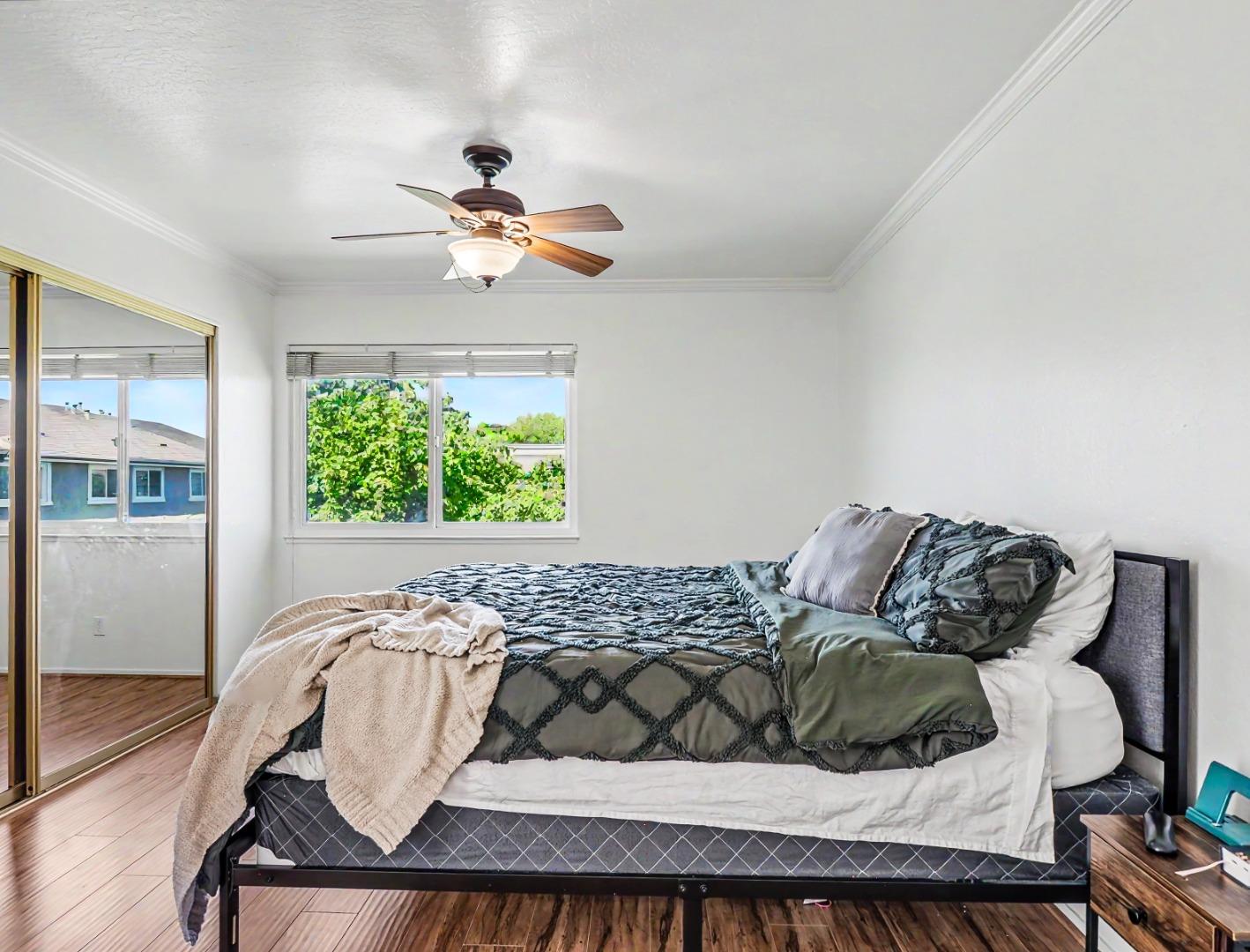 1310 Primavera Street, Unit 109 Salinas, CA 93901 - Photo 16 of 37 a view of a bedroom with furniture and a window