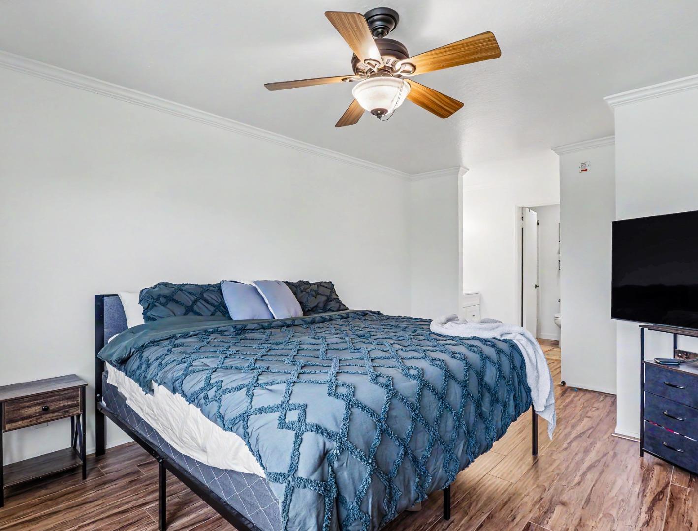 1310 Primavera Street, Unit 109 Salinas, CA 93901 - Photo 17 of 37 a bedroom with a bed and a flat screen tv