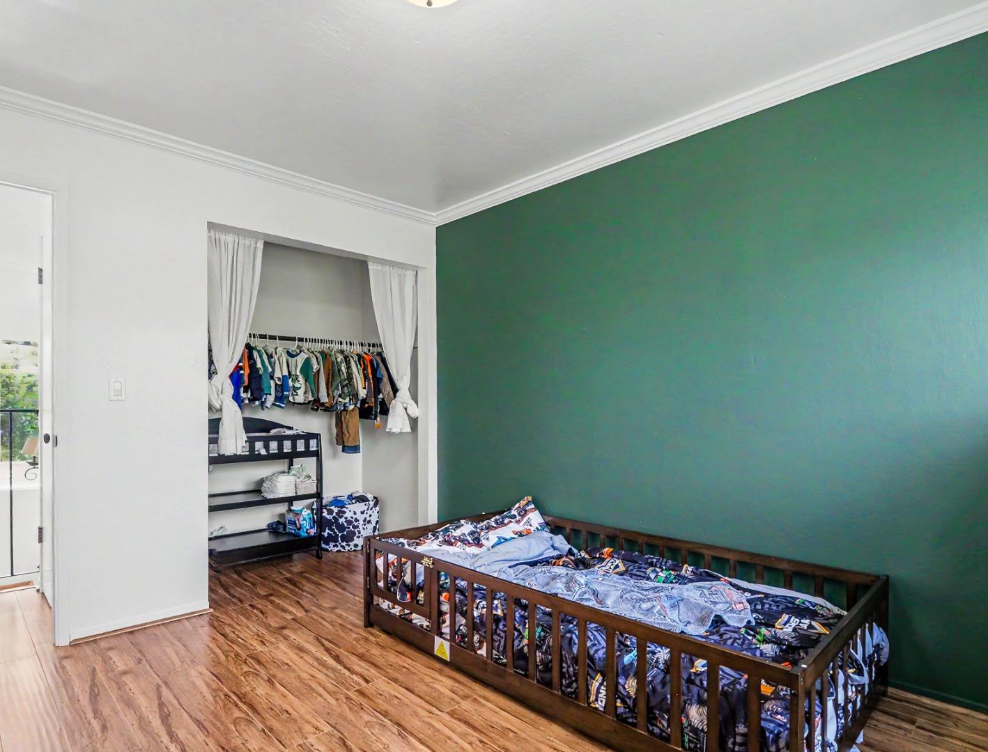 1310 Primavera Street, Unit 109 Salinas, CA 93901 - Photo 24 of 37 a bedroom with a bed and a flat tv screen on the dresser