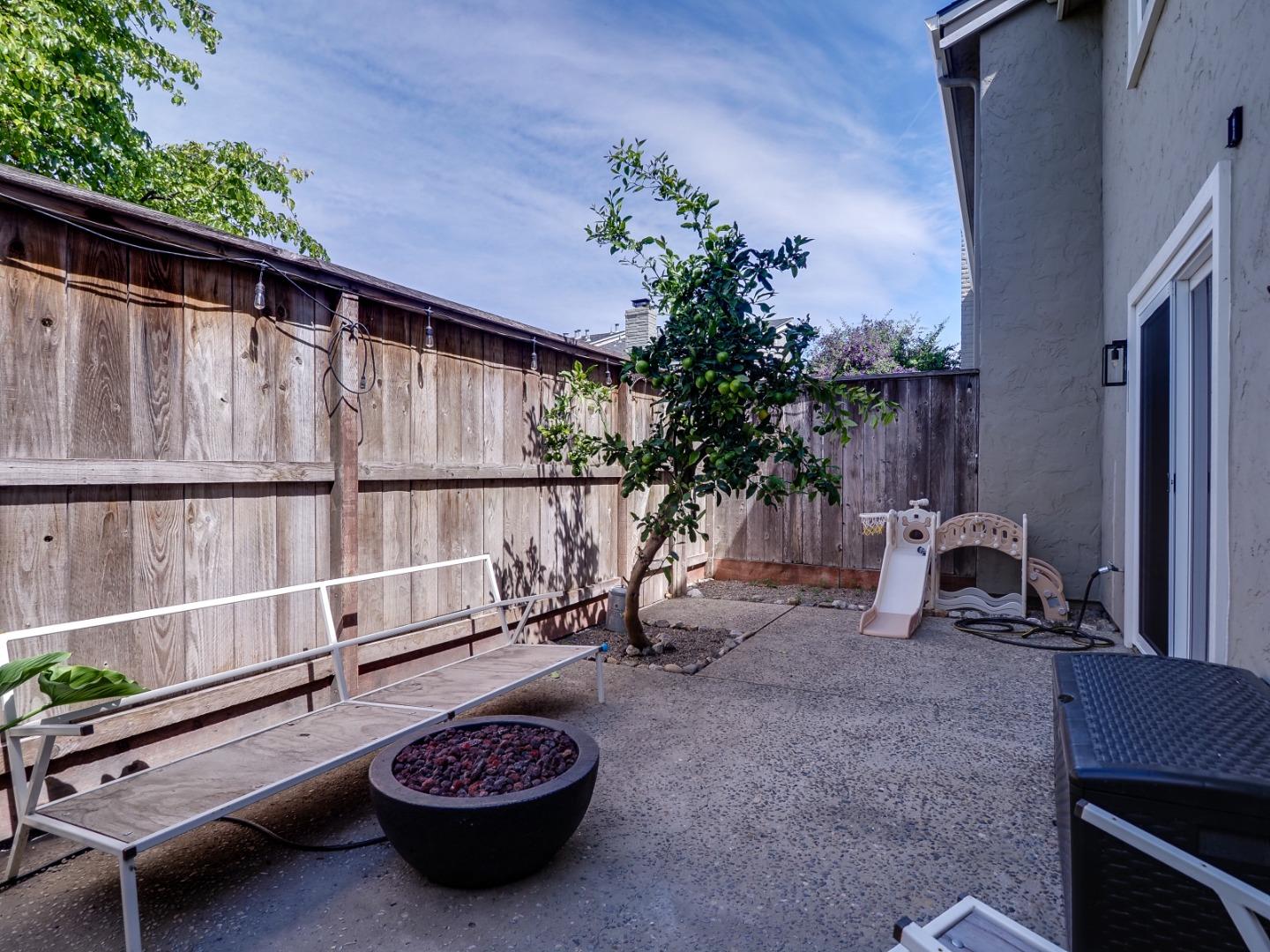 1310 Primavera Street, Unit 109 Salinas, CA 93901 - Photo 25 of 37 a view of a backyard with a sitting area and furniture