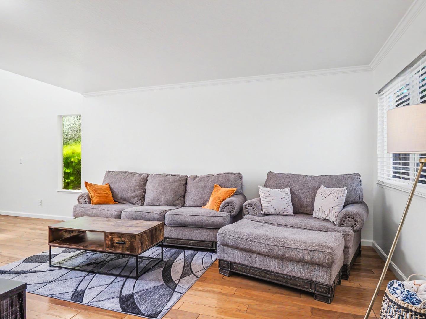 1310 Primavera Street, Unit 109 Salinas, CA 93901 - Photo 10 of 37 a living room with furniture and a couch