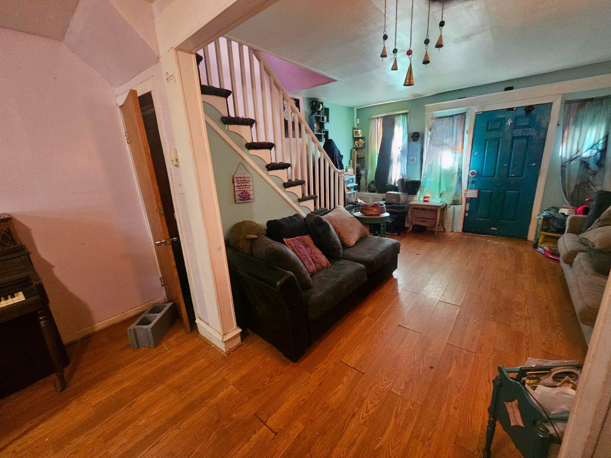 6913 Rodney Street Philadelphia, PA 19138 - Photo 3 of 17 a living room with furniture and a chandelier