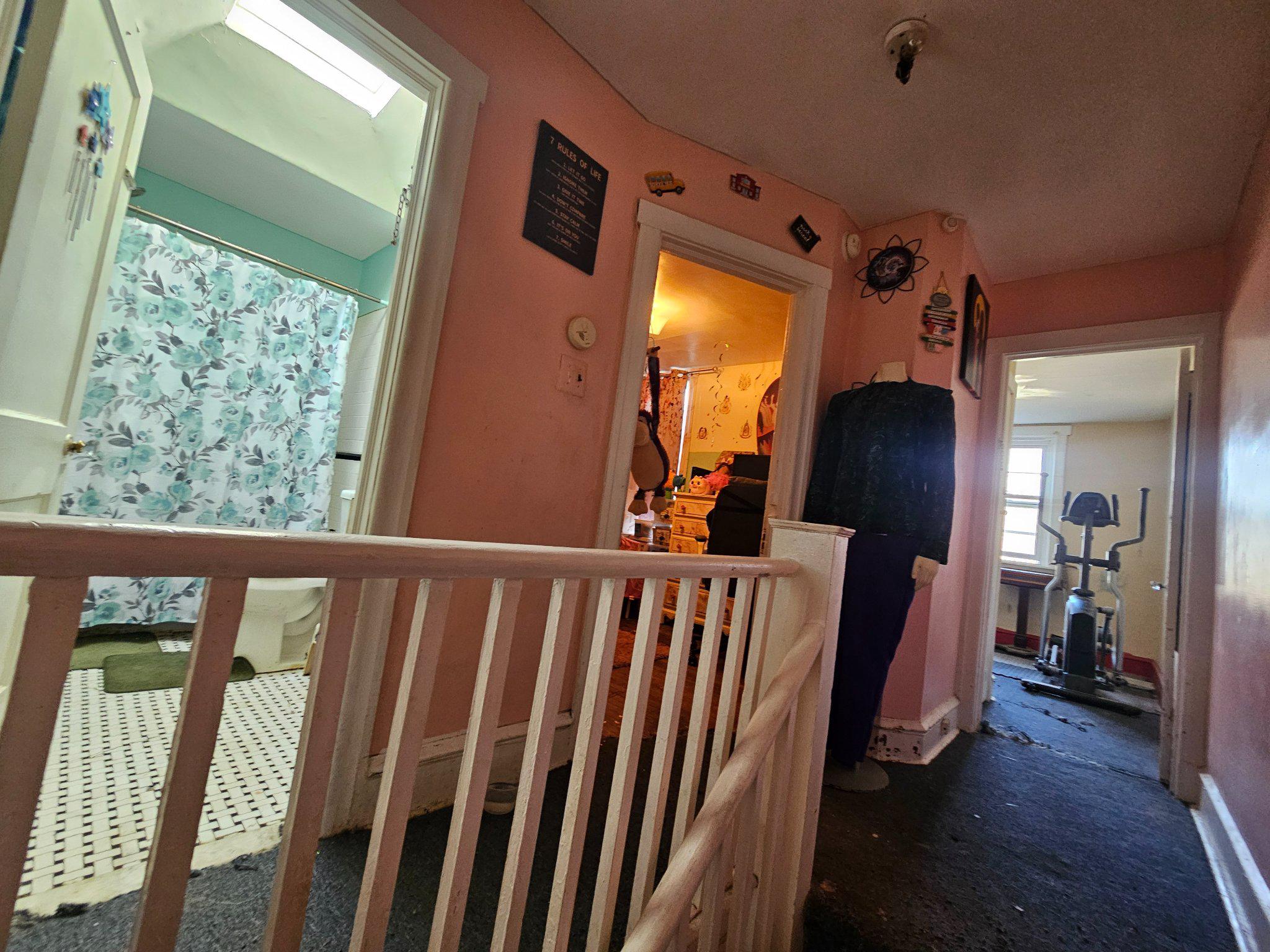 6913 Rodney Street Philadelphia, PA 19138 - Photo 9 of 17 a view of a hallway and wooden floor and stairs