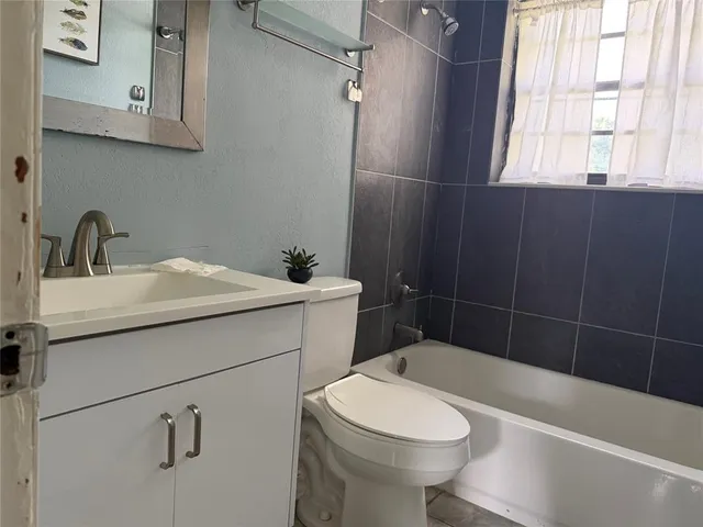 a view of empty room with cabinet