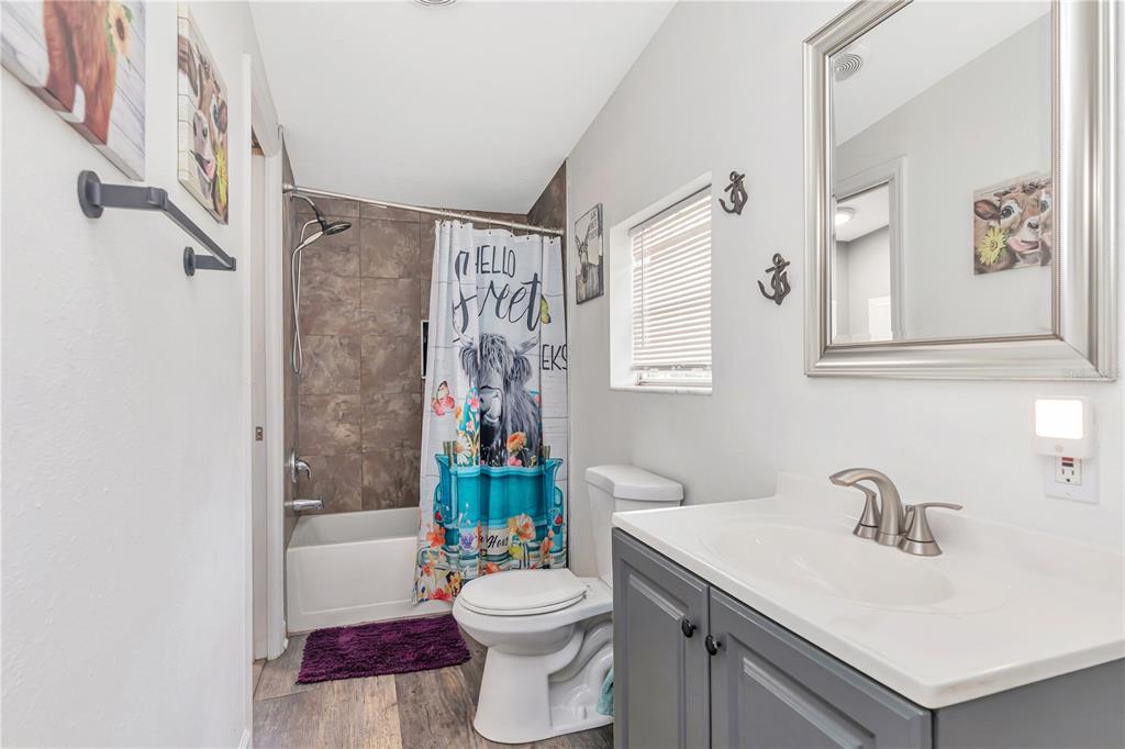 16323 Alliance Lane Spring Hill, FL 34610 - Photo 11 of 34 a bathroom with a sink toilet and shower