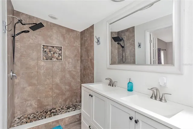 a bathroom with a sink and a mirror