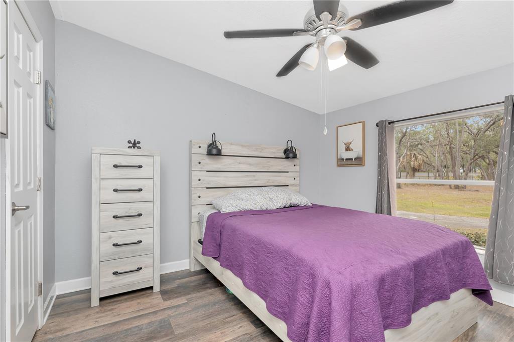 16323 Alliance Lane Spring Hill, FL 34610 - Photo 18 of 34 a bedroom with a bed and a closet