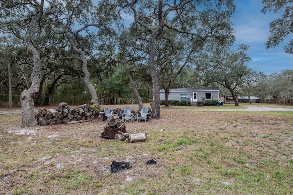16323 Alliance Lane Spring Hill, FL 34610 - Photo 24 of 34 a view of backyard with a car parked