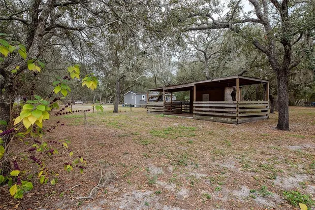 a view of backyard with seating space