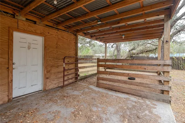 a view of a yard with a tree