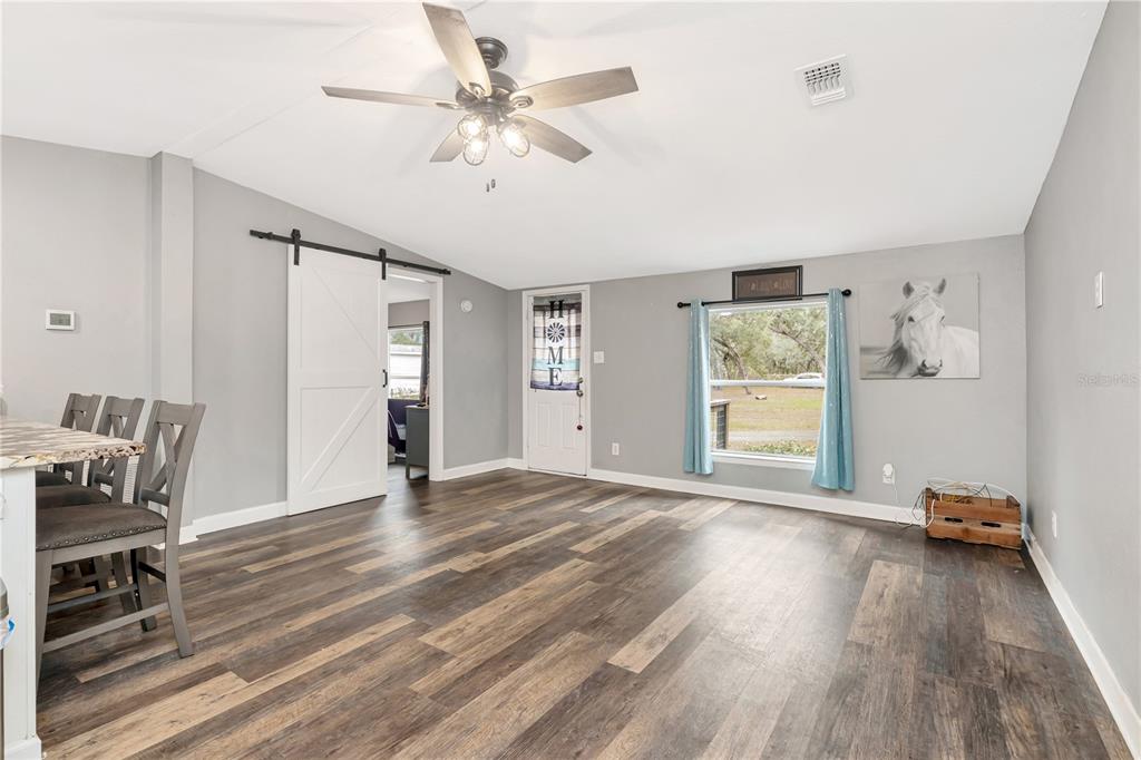 16323 Alliance Lane Spring Hill, FL 34610 - Photo 4 of 34 a view of empty room with wooden floor