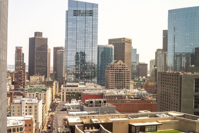 a view of city with tall buildings