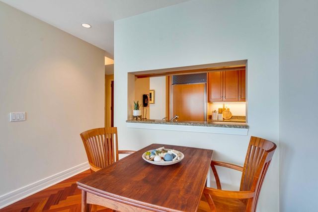 a view of a dining room with furniture and a window