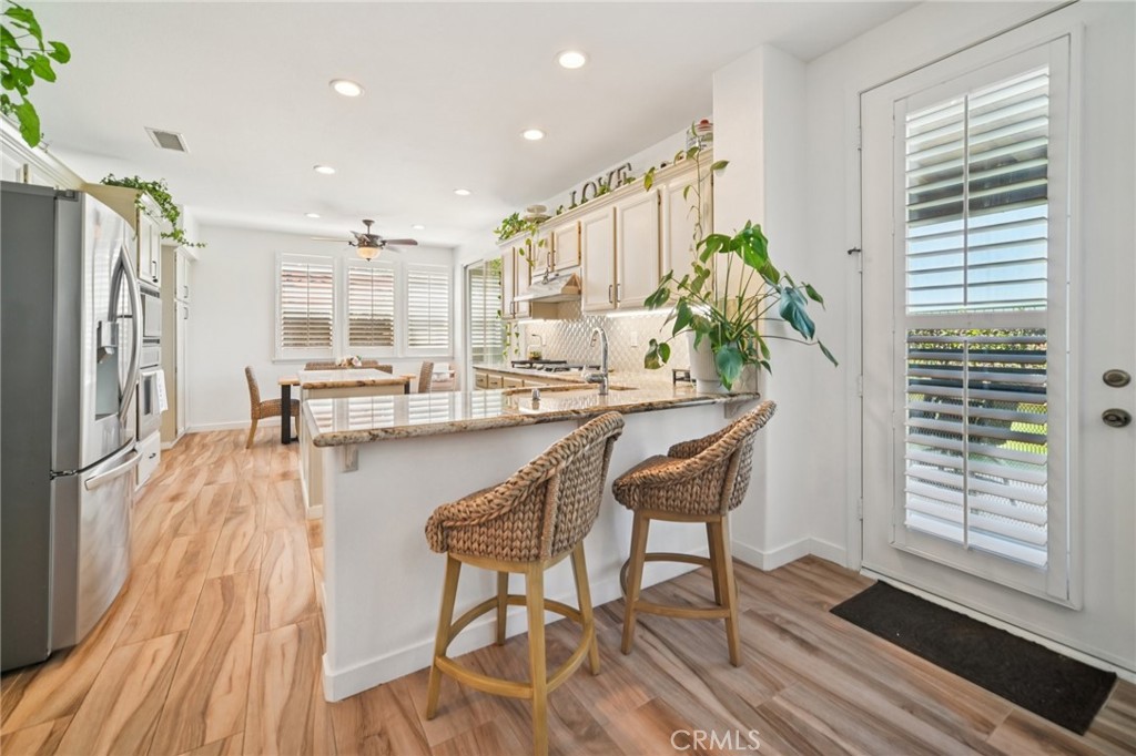 1029 Poppy Tree Place Simi Valley, CA 93065 - Photo 19 of 60 a dining room with furniture and a wooden floor