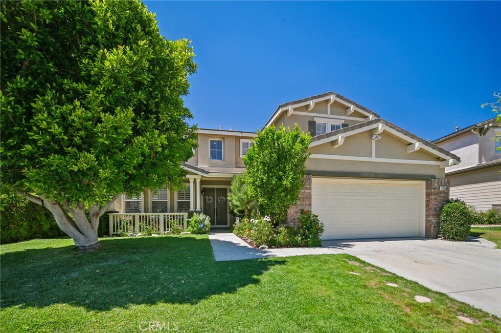 1029 Poppy Tree Place Simi Valley, CA 93065 - Photo 5 of 60 a front view of a house with a yard