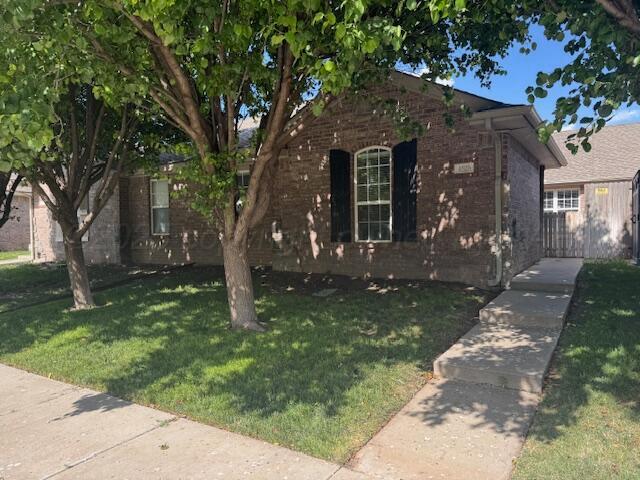 front view of a house with a yard