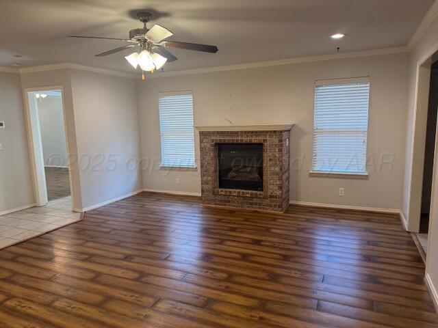 4525 Ida Louise Court Amarillo, TX 79110 - Photo 2 of 14 a view of an empty room with wooden floor fireplace and a window