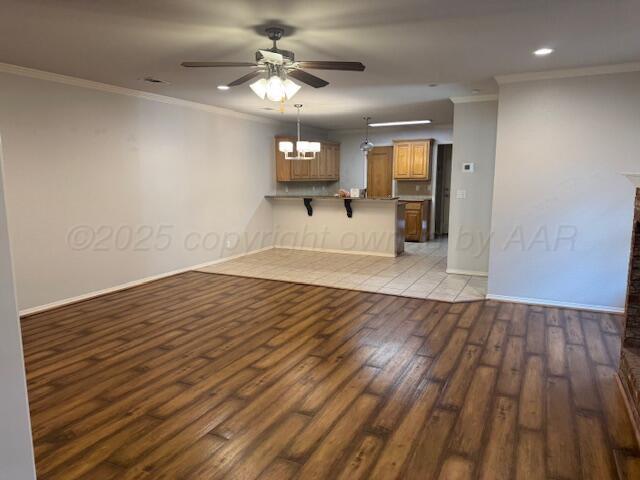 4525 Ida Louise Court Amarillo, TX 79110 - Photo 3 of 14 wooden floor in an empty room with a window