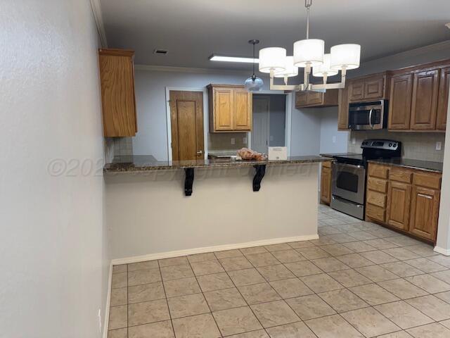 4525 Ida Louise Court Amarillo, TX 79110 - Photo 4 of 14 a view of kitchen with a sink stainless steel appliances and cabinets