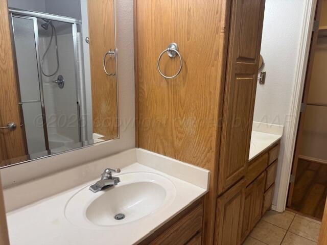 4525 Ida Louise Court Amarillo, TX 79110 - Photo 10 of 14 a bathroom with a sink and mirror