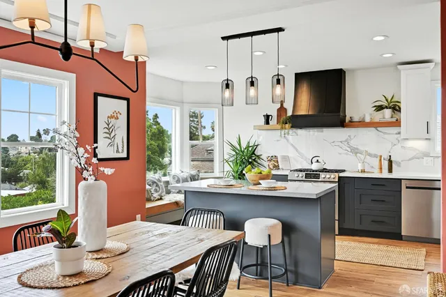 a kitchen with granite countertop a sink and cabinets