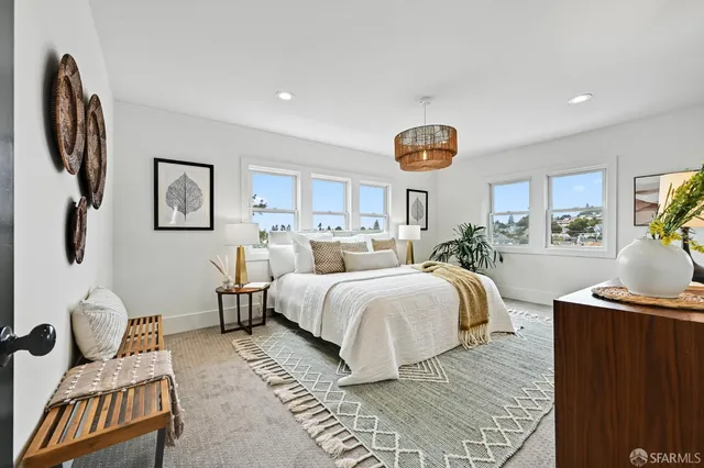 a bedroom with bed and a window