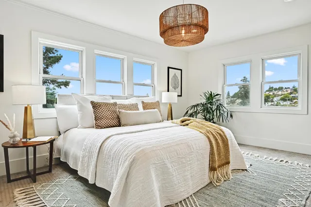 a bedroom with a bed and a dresser