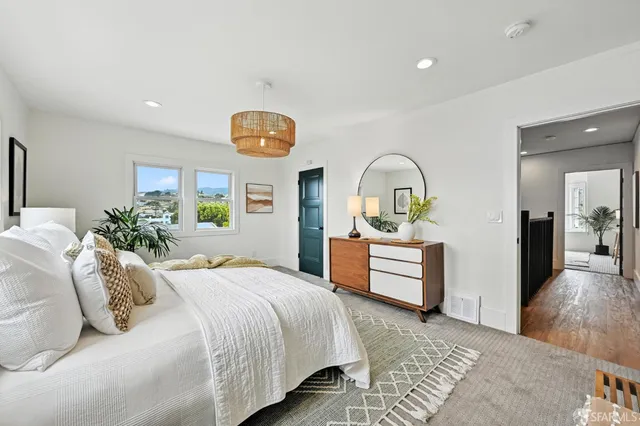 a bathroom with a granite countertop sink a toilet and shower