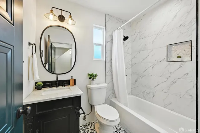 a view of a balcony with wooden floor and outdoor seating