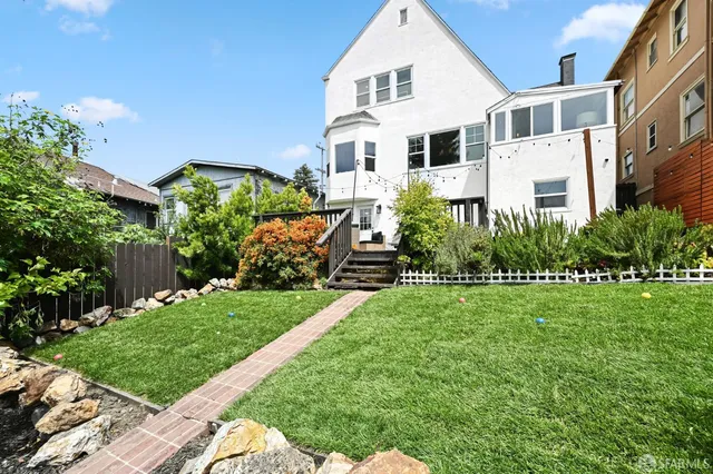 a view of a house with potted plants