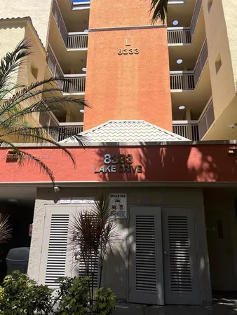 a front view of a building with retail shops