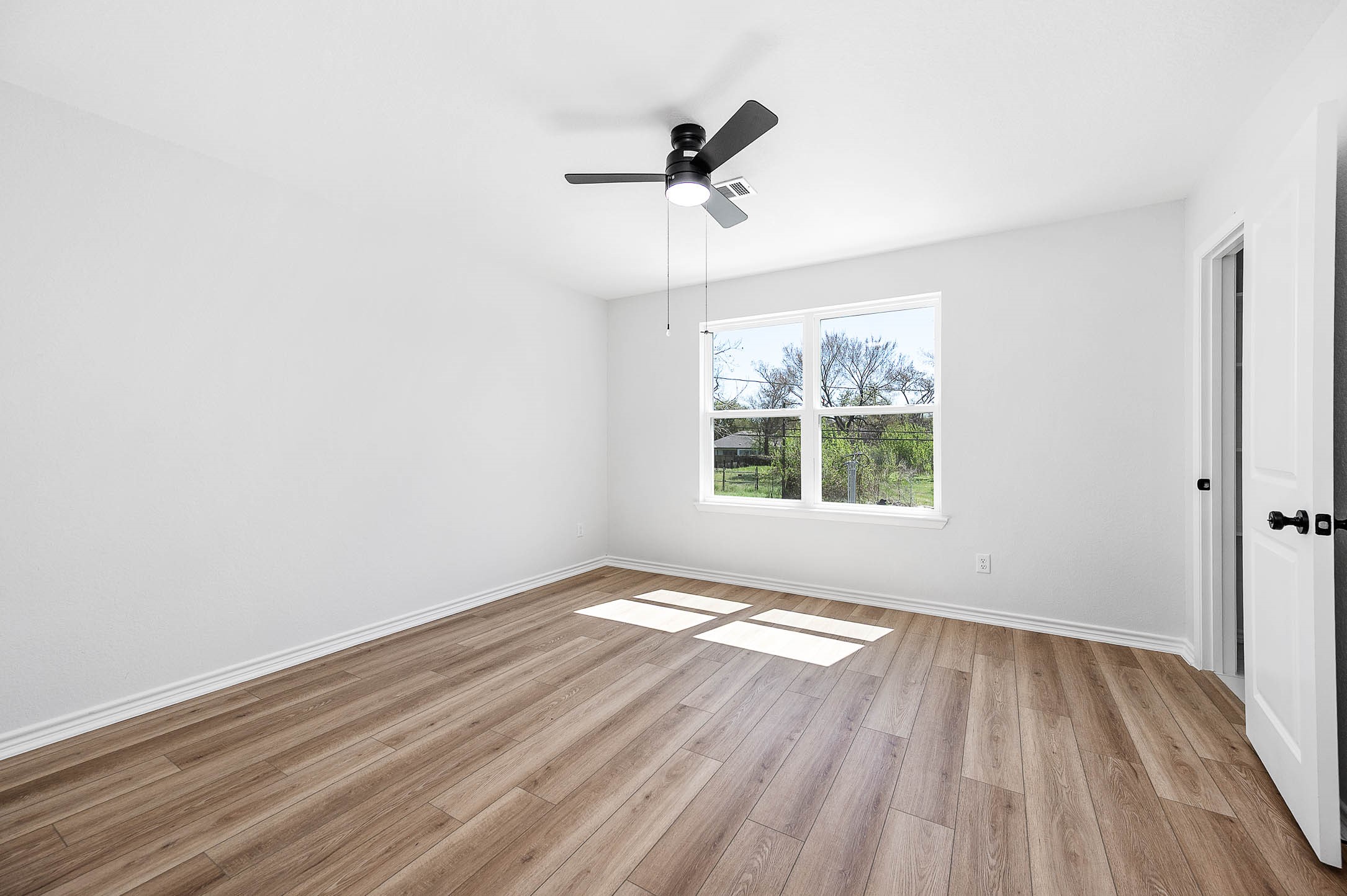 2018 Hampton Street, Unit A B Houston, TX 77088 - Photo 16 of 31 Wide windows let morning light fill the primary suite.