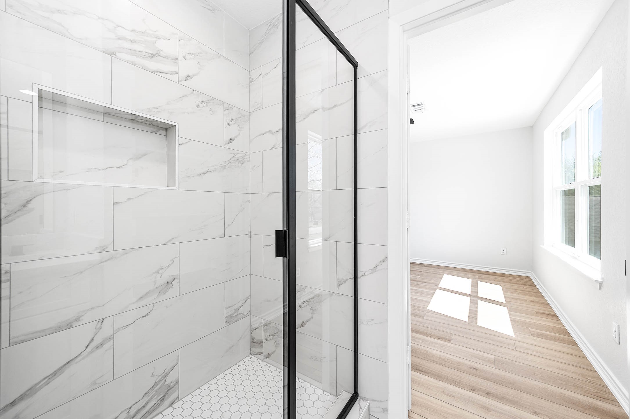 2018 Hampton Street, Unit A B Houston, TX 77088 - Photo 20 of 31 Large walk-in shower with full tile surround in primary bath