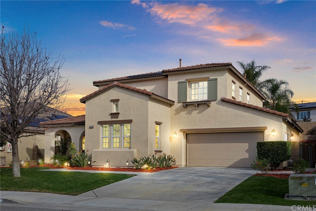 31122 Tiverton Road Menifee, CA 92584 - Photo 1 of 1 a front view of a house with a yard and garage