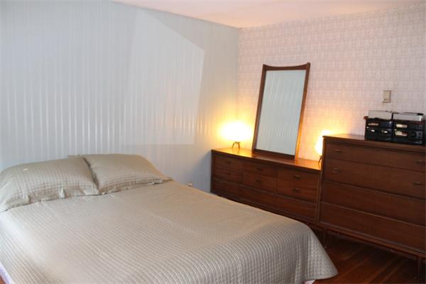 524 Marrett Road Lexington, MA 02421 - Photo 11 of 15 a bedroom with a bed and a dresser