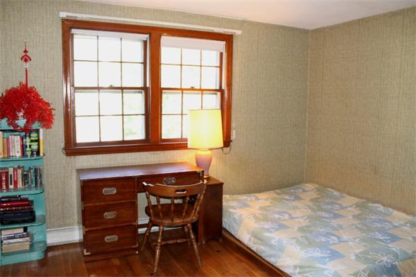 524 Marrett Road Lexington, MA 02421 - Photo 12 of 15 a bedroom with a bed and a window