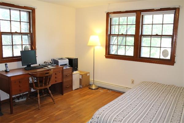 524 Marrett Road Lexington, MA 02421 - Photo 13 of 15 a bedroom with a bed and a window