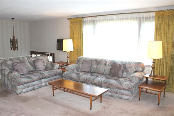 524 Marrett Road Lexington, MA 02421 - Photo 2 of 15 a living room with a couch and a table