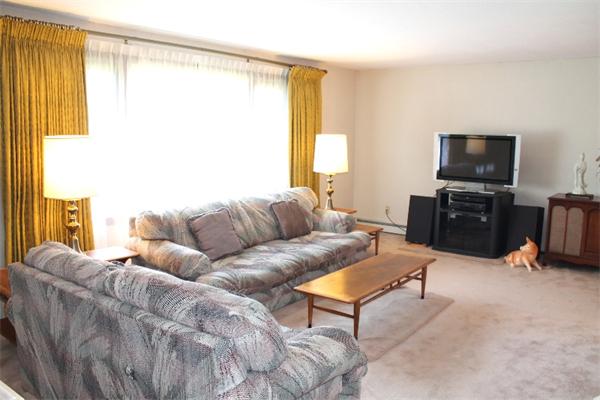524 Marrett Road Lexington, MA 02421 - Photo 3 of 15 a living room with furniture and a flat screen tv