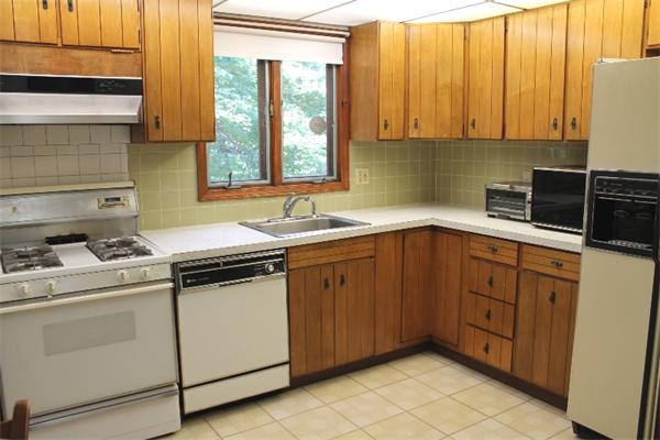 524 Marrett Road Lexington, MA 02421 - Photo 7 of 15 a kitchen with a sink stove and cabinets