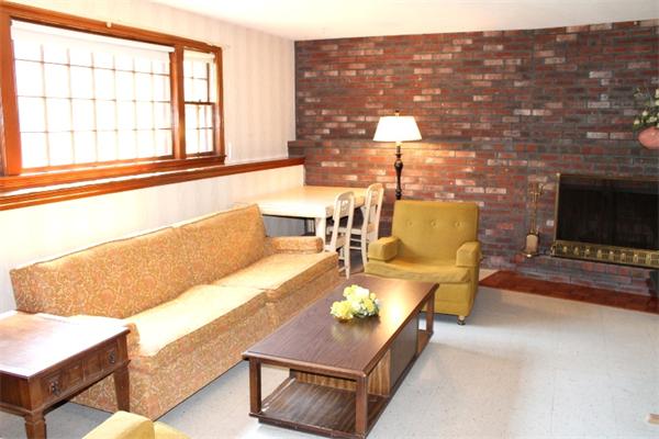 524 Marrett Road Lexington, MA 02421 - Photo 9 of 15 a living room with furniture and a fireplace