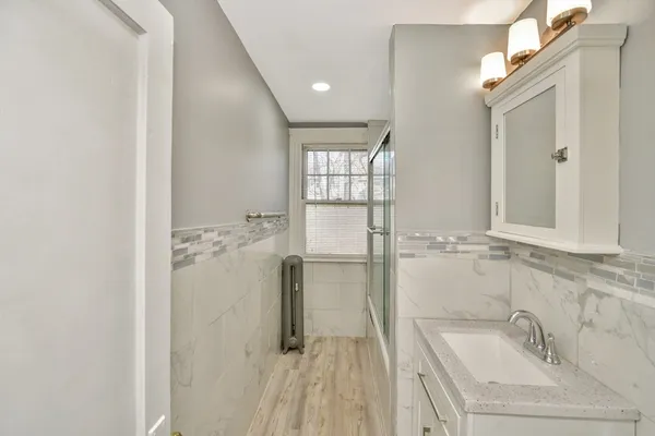 a bathroom with a bathtub and shower