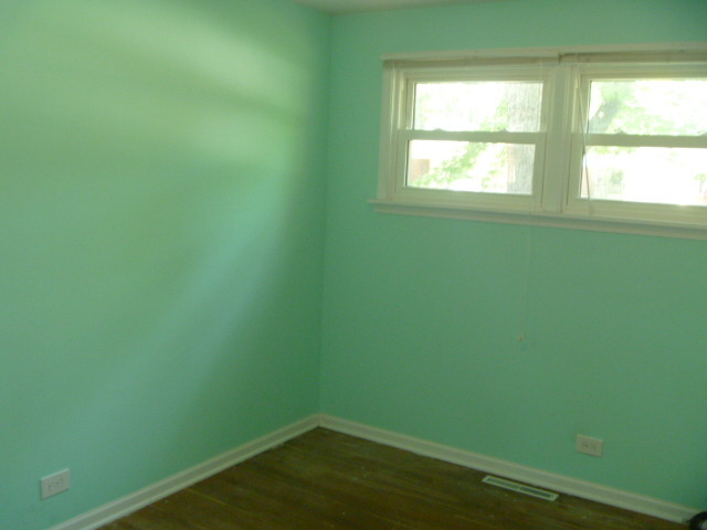 1513 North Ridge Avenue Arlington Heights, IL 60004 - Photo 10 of 14 a view of a small space with wooden floor and a window