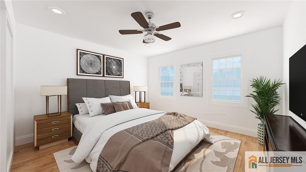 180 River Road Monroe Township, NJ 08831 - Photo 12 of 22 a bedroom with a large bed and a ceiling fan