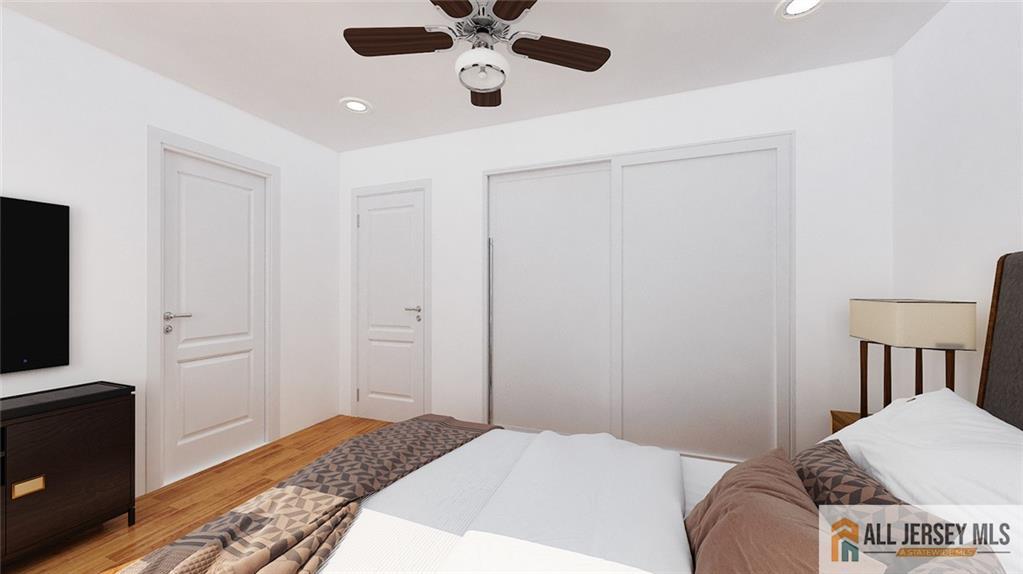 180 River Road Monroe Township, NJ 08831 - Photo 13 of 22 a bedroom with a bed and a flat tv screen on dresser