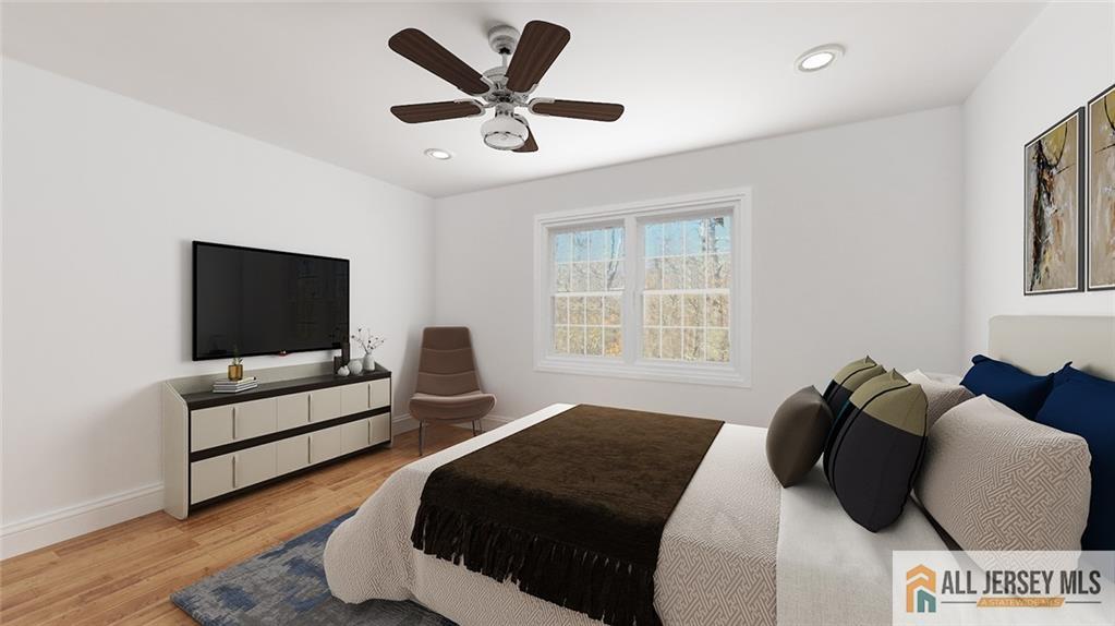 180 River Road Monroe Township, NJ 08831 - Photo 14 of 22 a bedroom with a bed and a couch