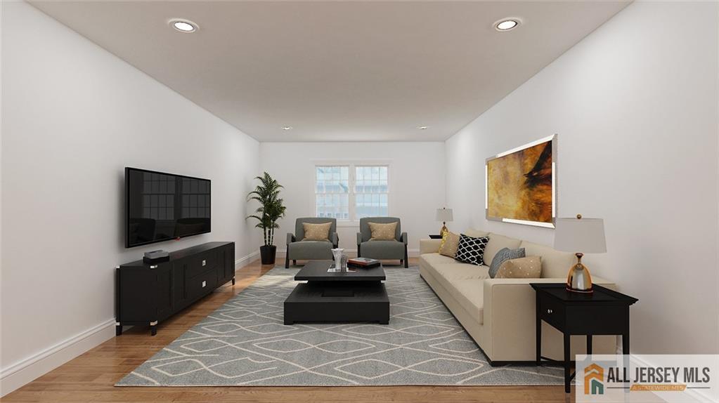 180 River Road Monroe Township, NJ 08831 - Photo 16 of 22 a living room with furniture and a flat screen tv