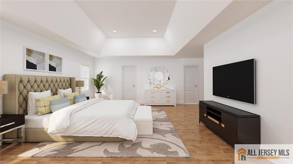 180 River Road Monroe Township, NJ 08831 - Photo 17 of 22 a bedroom with a bed and a flat screen tv